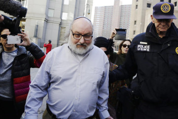 Convicted spy Jonathan Pollard leaves a federal courthouse in New York Friday, Nov. 20, 2015. Within hours of his release, Pollard's attorneys began a court challenge to terms of his parole. He served 30 years for selling intelligence secrets to Israel. (AP Photo/Mark Lennihan)